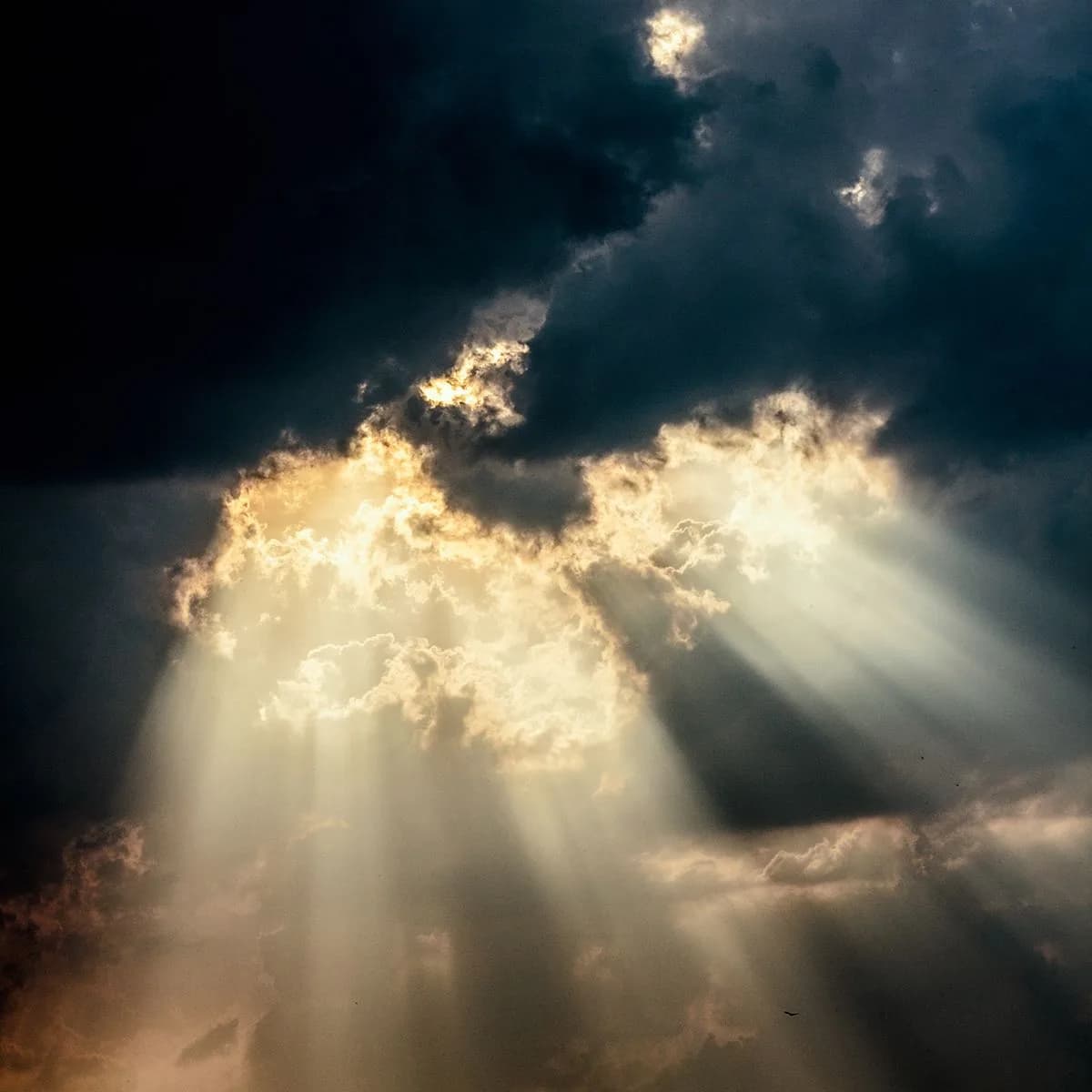 Sunlight breaking through dramatic clouds